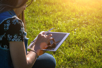 Laptop outdoor business technology. Student girl person work on tablet, computer in summer park. Online woman in nature outside. Happy hipster young distance learning concept.