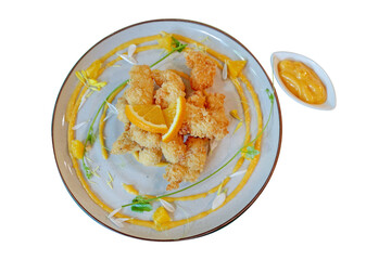 Crispy Chicken with orange sauce on beautiful ceramic plate on white isolated.
