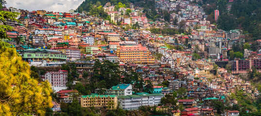Beautiful panoramic cityscape of Shimla, the state capital of Himachal Pradesh located amidst Himalayas of India. - obrazy, fototapety, plakaty