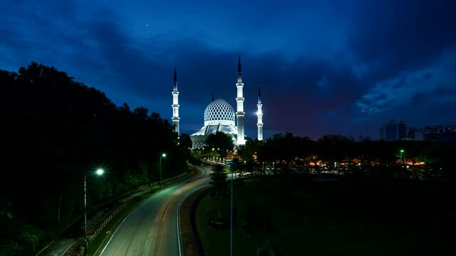Sunset time lapse at the Abdul Aziz Shah Moschee at Shah Alam, Selangor, Malaysia near Kuala Lumpur. Colorful spectacular sunset timelapse on a mosque at the klang valley Malaysia
