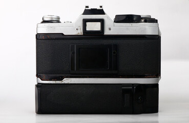 Old and vintage single lens reflex or SLR film camera isolated on white background