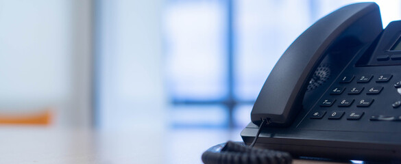 close up telephone landline at office background fo telecommunication technology and business concept	