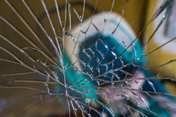 baby stroller seen through a broken window.  Concept of child harm, e.g. kidnapping, harassment, difficulties in ensuring the safety of minors