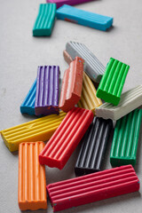 Fototapeta premium multicolored object plastic, sticks of plasticine. Mix of scattered clay