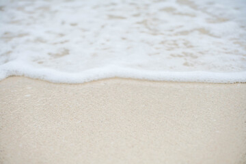 Sea wave bubble On the white sand beach