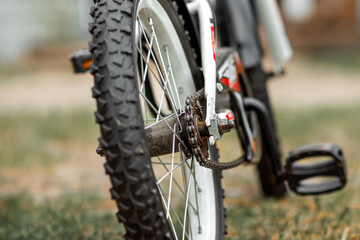 Fototapeta na wymiar Wheel with a tread with a chain closeup. Bike, cardio workout.