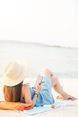 woman enjoy use smartphone  on the beach