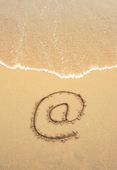 Fototapeta na wymiar Email symbol draw on beach