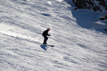 skiing in the mountains in winter