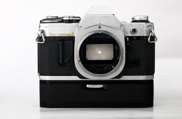 Old and vintage single lens reflex or SLR film camera isolated on white background