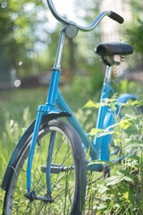 Fototapeta na wymiar old bicycle on a green grass