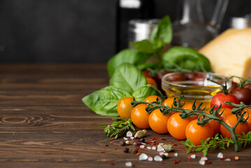 small yellow cherry tomatoes on a branch with spices and seasonings