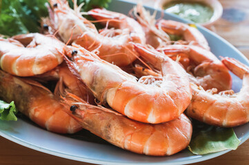 Salt baked prawn serve with lettuce on a dish