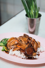 Rice with crispy pork, roasted pork and red sauce