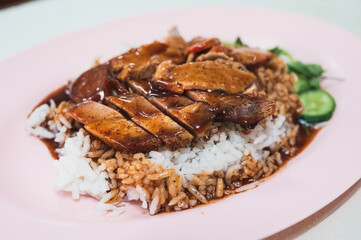 Rice with crispy pork, roasted pork and red sauce