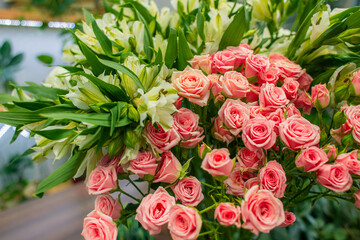 Flower shop. Interior and bouquets of fresh pink decorative roses