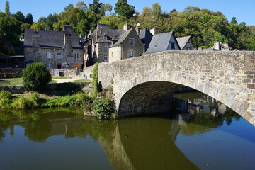 Fototapeta na wymiar old stone bridge over the river in france with mirror reflection in the river