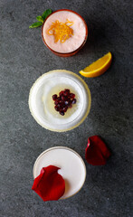 Alcoholic cocktails on a gray background