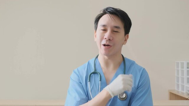 portrait of smart asian doctor explain and suggesting a way to takecare yourself with happiness smiling cheerful Caring for patients at the hospital