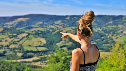 woman tourist pointing beautiful countryside