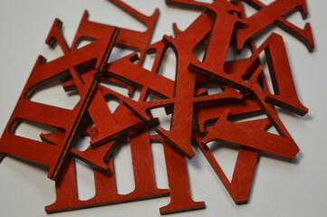 Wooden red roman numerals on a white background