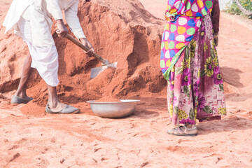 Image of worker on site location with spade 