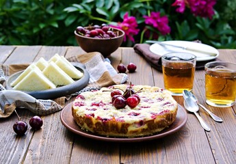 Afternoon tea in the garden with cherry pie and cucumber tea sandwiches.