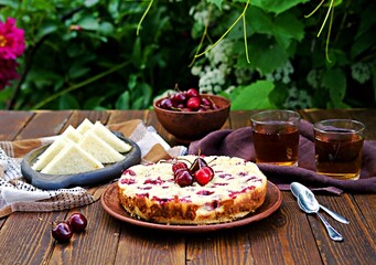 Afternoon tea in the garden with cherry pie and cucumber tea sandwiches.