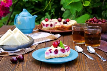 Afternoon tea in the garden with cherry pie and cucumber tea sandwiches.