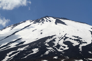 The peak of Mount Fuji, Japan, which is always covered with snow. Mount Fuji is the highest mountain in Japan