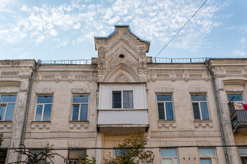 Fototapeta na wymiar Kyiv (Kiev), Ukraine - July 04, 2020: An ugly plastic balcony on a pre-revolutionary building