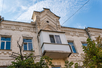 Kyiv (Kiev), Ukraine - July 04, 2020: An ugly plastic balcony on a pre-revolutionary building