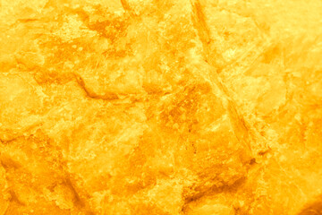 Yellow stone background with a fine texture on the theme of crystal or honey