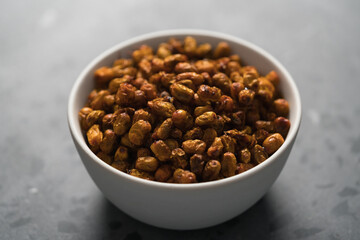 dried seaberry buckthorn in white bowl on terrazzo countertop