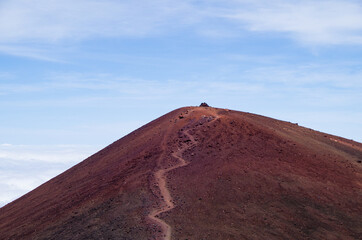 View of Volcano craters from Mauna Kea Mountain summit at sunset on Big Island in Hawaii with...
