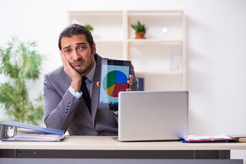 Young businessman employee sitting in the office