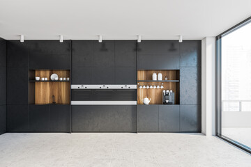 Black kitchen with countertops and balcony