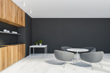 Black and wooden kitchen with round table