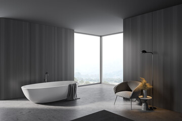 Grey and wooden bathroom corner, tub and armchair