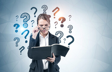 Concerned woman in glasses, question marks