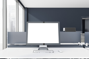 Mock up computer screen in grey office