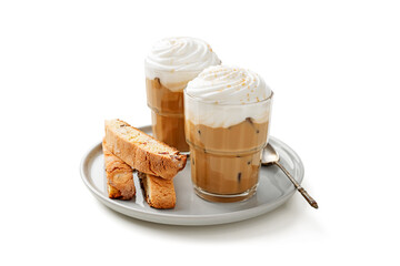 Iced coffee latte with whipped cream and biscotti cookies in glass. isolated on white background