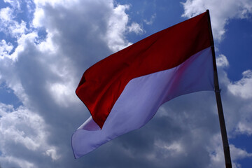 Indonesia Flag Fluttered in the Blue Sky. Indonesian Independence Day.