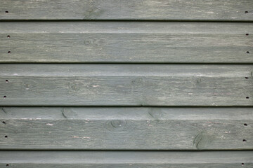 Obraz premium Grooved weathered wooden background with nail holes and space for copy