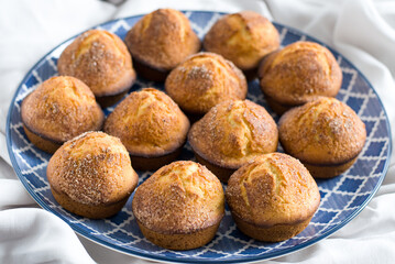 Delicious cupcakes on a blue plate