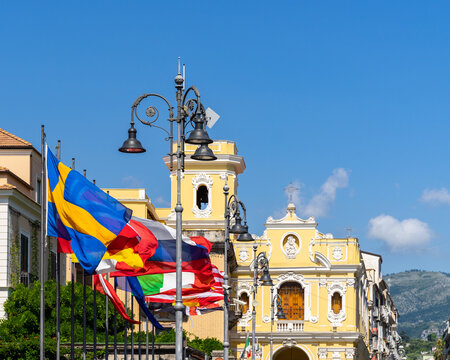 Various international flags waving at Piazza Tasso, the main square of Sorrento historic center, Campania, Italy.