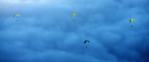 Paragliding over a sea of clouds, El Teide National Park, Spain, Europe
