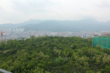 SEOUL, SOUTH KOREA ;  Aerial view of Seoul, houses and forest view .