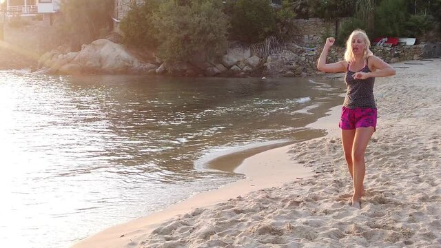 Angry girl in the Scaglieri beach of Elba island in Italy screaming in SLOW MOTION. Tyrrhenian sea holiday travel. Funny squabble on the beach.