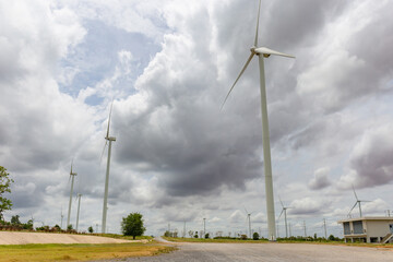 Wind turbines on a green field, Clean and Renewable Energy concept